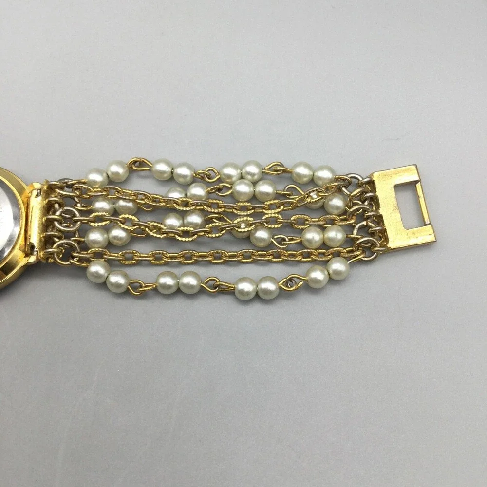 Futura Womens Watch 25mm MOP Dial Gold Tone Faux Pearl 3216 New Battery 6.75